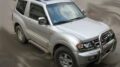 Φανάρια εμπρός για Mitsubishi Pajero (2001-2006) - μαύρα , με λάμπες (Η1) - σετ 2τμχ.
